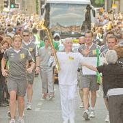 Stan Wild, pictured carrying the Olympic torch through York in 2012