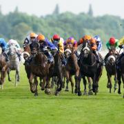 Capote's Dream and Jim Crowley (right, yellow) coming home to win the John Smith's Sprint Handicap on Knavesmire earlier this year. Picture: Martin Rickett/PA Wire