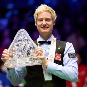 York snooker star Ashley Hugill will face Neil Robertson, posing with the Cazoo Masters trophy, in the first round of the World Snooker Championship. Picture: John Walton/PA Wire
