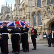 Marine David Hart's coffin is carried from York Minster.
