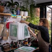 Jane Dignum lino printing in her studio/conservatory