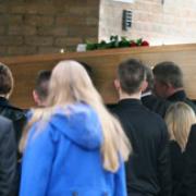 The coffin of Mark Webb is carried into the chapel at York Crematorium