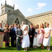 Saxton CE Primary School pupils stage their own royal wedding in the local church, presided over by the Rev Peter Brindle