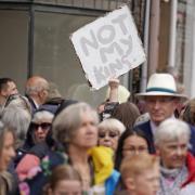 A protestor holds us a Not My King placard during King Charles III and Queen Camilla's visit to Galashiels, in the Scottish Borders,Thursday July 6, 2023. PA Photo