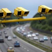Speed cameras above a motorway.  Picture: Newsquest