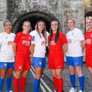 York City Ladies pose in their new home and away kits.