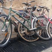 Bikes chained up over the air vent in Brasenose Lane. Picture Andy Ffrench
