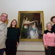 Randy Etty (left) and his family come face to face with York Art Gallery’s noted William Etty painting ‘Getting Ready for the Fancy Dress Ball’