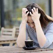 Photo of a woman looking anxious. Our columnist looks at how to break the cycle of negative thinking