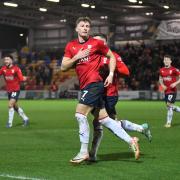 Will Davies celebrates drawing York City level against Oldham Athletic.