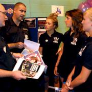 Community safety officer Ian Calvert, left, and Stuart Moss chat to students Lucie Greenfield, Katie Greene, and Xanthe Hague at the Freshers’ Week event at York St John University about Think, Don’t Swim
