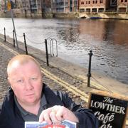 Shaun Binns, of The Lowther, in York, with one of the Think, Don’t Swim posters