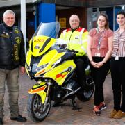 Andy Hunn, Whiteknight Andy Richardson, and Biomedical Scientists, Victoria Graham and Tyla Kirk with the new blood bike