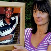 Belinda Martin with a picture of her brother, Lee Calam, who drowned in the Ouse