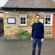 Helmsley's representative Councillor George Jabbour outside the public toilets in Helmsley