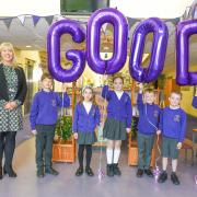 Our Lady Queen of Martyrs head teacher Emma Barrs with pupils as the school is rated 'good' by Ofsted