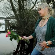 Jordan Sullivan’s mother, Nicola Jobling, throws roses into the river close to the spot where he died