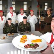 Staff Sergeant Alan Betteridge with his team of chefs, Sgt Michael McIntosh, Pt John Rutter, Cpl Kevin Bruce and Pt Nicholas Varey, with Sgt Marie Bailey, left, WO1 (RSM) Duncan Lamont and Lt Col Colin Vaudin, commanding Officer of 2 Signal Regiment
