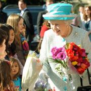 The Queen receives flowers from children outside the Yorkshire Museum