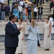 Princess Royal is handed the Olympic torch at the start of its journey in Greece