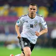 Lukas Podolski marked his 100th appearance from Germany with a goal against Denmark