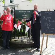 Hotel du Vin York general manager David Macdonald and              BHF York committee colunteer Murray Halliday prepare for the Olympic torch relay barbecue