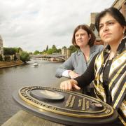 Conservative Party Chairman Baroness Sayeeda Warsi, right, and Conservative Police and Crime Commissioner candidate Julia Mulligan stand by the plaque to the memory of Richard Horrocks who died trying to swim across the River Ouse