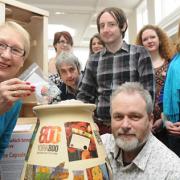 Coun Sonja Crisp and artist Kane Cunningham with volunteers with the clay pot that will become a time capsule in York’s bar walls