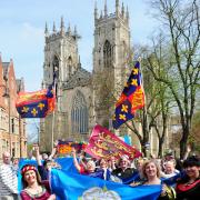 Descendants and supporters of King Richard III paraded through the streets of York demanding his burial in the city