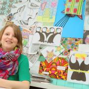 Georgia Wilkinson in front of her inspiration board