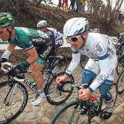 France’s Thomas Voeckler and Germany’s John Degenkolb climb the steepest part of the cobbled Koppenberg hill, during the 97th edition of the UCI World Tour Belgian cycling classic Tour of Flanders, in Belgium, last year