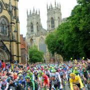 The Tour De France arrives at Duncombe Place in the shadow of York Minster this morning