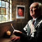 Peter Lawrence lights a candle earlier this year in memory of his missing daughter Claudia, in the Archbishop’s private chapel at Bishopthorpe Palace