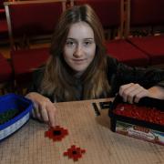16-year-old Mary Rice starts work on the First World War mosaic at St Peter’s Church in Norton
