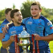 KNIGHTS PRIDE: York City Knights’ new captain Pat Smith, left, with brother Ed Smith and the Championship One leader leaders’ trophy