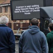 Members of the public watch the footage in Heworth