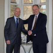Andrew Lowson, left, being welcomed to the role of York BID executive director by Adam Sinclair, chairman of the BID company