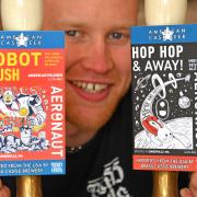 Sam Teale of Brass Castle Brewery, with pumpclips two of the American beers. Picture: Dave Harrison