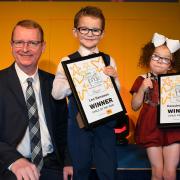 FLASHBACK: Andy Dyson, the joint managing director of the Saville Group, presents the 2018 Child of the Year award to joint winners Bobbie Coverdale and Daisybella Bond