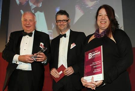Prof Colin Mellors (left), from the University of York, presents the Best Business and Higher Education Link award to Robert Teed and Paula Jackson of New School House Gallery