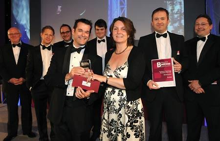 Nicola Spence, of Science City York, presents the Science and Technology Business of the Year award to Dr Paul Gibson and the team from PureNet.