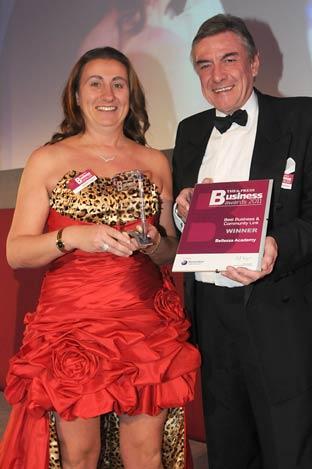 Ken Hesketh, of Benenden Healthcare Society, presents the Best Business and Community Link award to Angela Langton of Bellezza Academy.