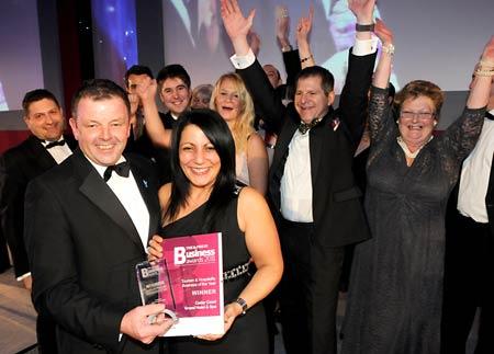 General Manager Maria Florou (foreground) and staff from the Cedar Court Grand Hotel and Spa, receive the Tourism and Hospitality Business of the Year award from Peter Dodd, of Welcome to Yorkshire.