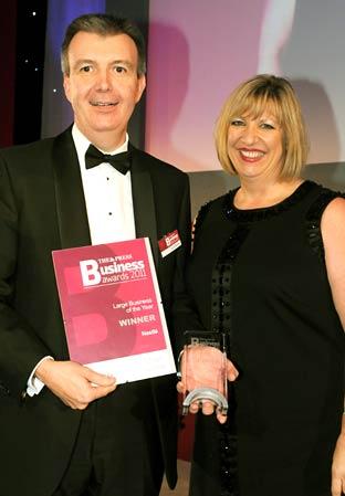 Karen Boswell of East Coast presents the Large Business of the Year award to David Rennie of Nestlé.