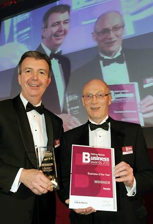 Steve Hughes (right), managing editor of The Press, presents The Press Business of the Year 2011 Award to David Rennie of Nestlé.