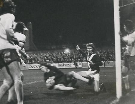 10/01/75 - York City 1, Southampton 1: Southampton goalkeeper Eric Martin dives to hold a header from Jimmy Seal following a corner by Ian Butler. Barry Swallow is just behind Martin.