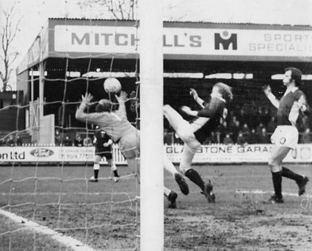 14/02/76 - York City 1, Carlisle United 2: Carlisle 'keeper Clarke pushes away a cross as Seal closes in.