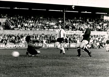 26/08/75 - York City 3, Bradford 0 (League Cup replay): Jimmy Seal scores York City's first with goalkeeper Peter Downsborough grounded after blocking a shot from Chris Jones.