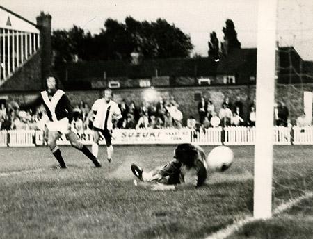 26/08/75 - York City 3, Bradford City 0 (League Cup replay): Bradford centre half John Middleton nips in to rob Jones in the act of shooting.