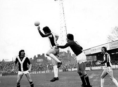 17/1/76 - York City 0, West Brom 1: Wile, the West Brom defender, heads away, with Chris Topping and Jimmy Hinch waiting for any slip.